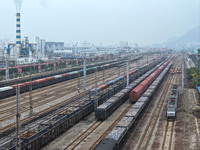 A China-Europe freight train loaded with containers waits to depart at the Lianyungang Port Railway marshalling station in Lianyungang, East...