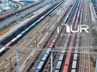 A China-Europe freight train loaded with containers waits to depart at the Lianyungang Port Railway marshalling station in Lianyungang, East...