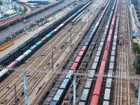 A China-Europe freight train loaded with containers waits to depart at the Lianyungang Port Railway marshalling station in Lianyungang, East...