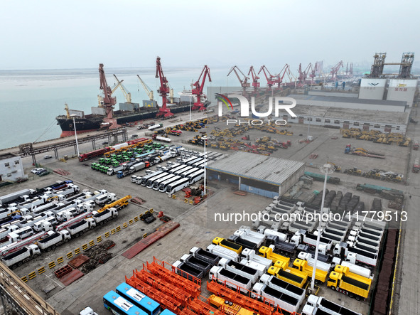 A large number of vehicles and machinery are ready for loading at the dock of the Oriental Port Branch of Lianyungang Port in East China's J...