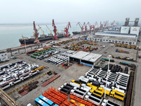 A large number of vehicles and machinery are ready for loading at the dock of the Oriental Port Branch of Lianyungang Port in East China's J...