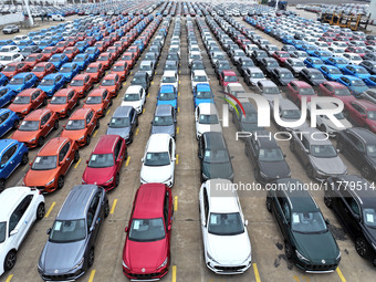 A large number of vehicles gather for loading at the port of East Port Branch in Lianyungang Port in East China's Jiangsu province on Novemb...