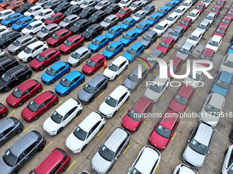 A large number of vehicles gather for loading at the port of East Port Branch in Lianyungang Port in East China's Jiangsu province on Novemb...