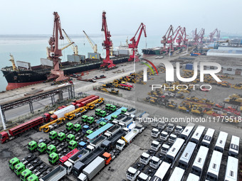 A large number of vehicles and machinery are ready for loading at the dock of the Oriental Port Branch of Lianyungang Port in East China's J...