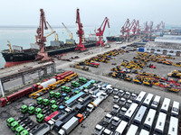 A large number of vehicles and machinery are ready for loading at the dock of the Oriental Port Branch of Lianyungang Port in East China's J...