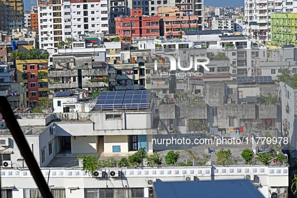 Solar energy panels are seen on the rooftops of a high-rise residential building in Dhaka, Bangladesh, on November 15, 2024. The building au...