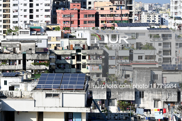 Solar energy panels are seen on the rooftops of a high-rise residential building in Dhaka, Bangladesh, on November 15, 2024. The building au...