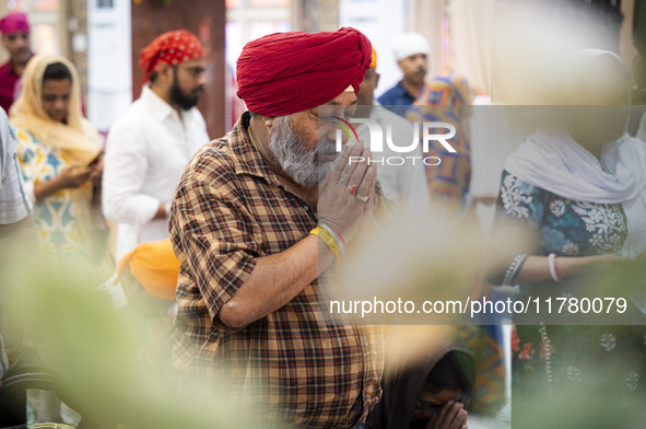 Sikh devotees offer prayers at a Gurudwara on the occasion of Guru Nanak Jayanti in Guwahati, Assam, India, on November 15, 2024. Guru Nanak...