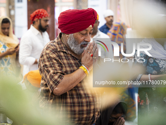 Sikh devotees offer prayers at a Gurudwara on the occasion of Guru Nanak Jayanti in Guwahati, Assam, India, on November 15, 2024. Guru Nanak...