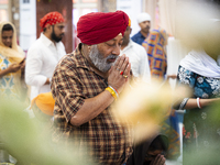 Sikh devotees offer prayers at a Gurudwara on the occasion of Guru Nanak Jayanti in Guwahati, Assam, India, on November 15, 2024. Guru Nanak...