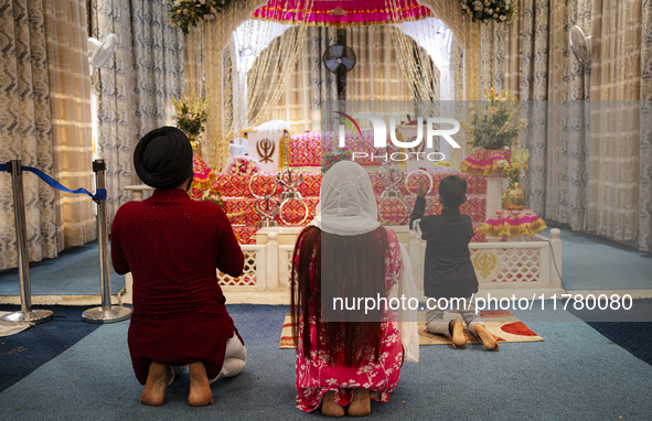 Sikh devotees offer prayers at a Gurudwara on the occasion of Guru Nanak Jayanti in Guwahati, Assam, India, on November 15, 2024. Guru Nanak...