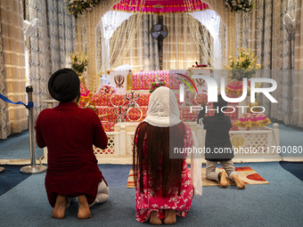 Sikh devotees offer prayers at a Gurudwara on the occasion of Guru Nanak Jayanti in Guwahati, Assam, India, on November 15, 2024. Guru Nanak...