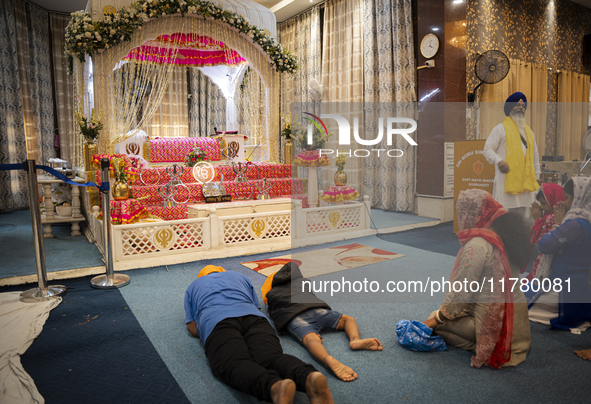 Sikh devotees offer prayers at a Gurudwara on the occasion of Guru Nanak Jayanti in Guwahati, Assam, India, on November 15, 2024. Guru Nanak...