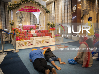 Sikh devotees offer prayers at a Gurudwara on the occasion of Guru Nanak Jayanti in Guwahati, Assam, India, on November 15, 2024. Guru Nanak...