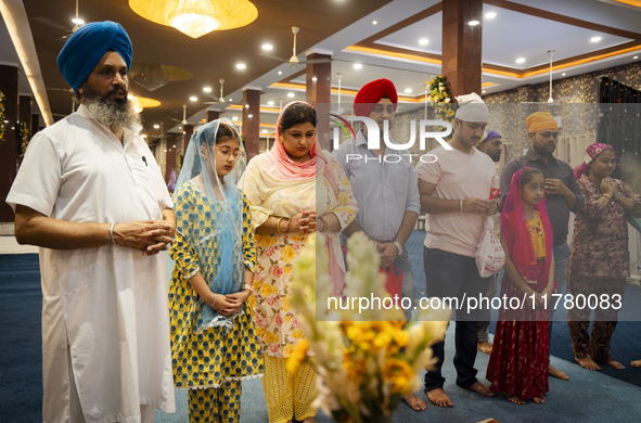 Sikh devotees offer prayers at a Gurudwara on the occasion of Guru Nanak Jayanti in Guwahati, Assam, India, on November 15, 2024. Guru Nanak...