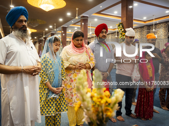 Sikh devotees offer prayers at a Gurudwara on the occasion of Guru Nanak Jayanti in Guwahati, Assam, India, on November 15, 2024. Guru Nanak...