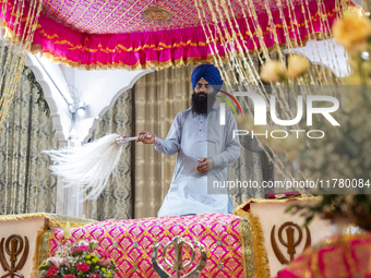 Sikh devotees offer prayers at a Gurudwara on the occasion of Guru Nanak Jayanti in Guwahati, Assam, India, on November 15, 2024. Guru Nanak...