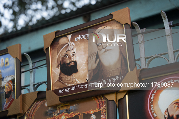 A framed photo of Guru Nanak Ji is sold near a Gurudwara on the occasion of Guru Nanak Jayanti in Guwahati, Assam, India, on November 15, 20...