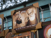 A framed photo of Guru Nanak Ji is sold near a Gurudwara on the occasion of Guru Nanak Jayanti in Guwahati, Assam, India, on November 15, 20...