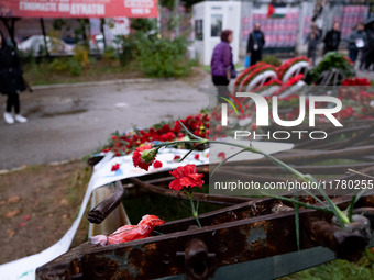 Carnations and wreaths are laid on a monument inside the Athens Polytechnic during the celebration of the 51st anniversary of the Polytechni...