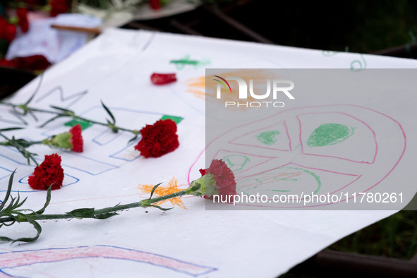 Carnations and wreaths are laid on a monument inside the Athens Polytechnic during the celebration of the 51st anniversary of the Polytechni...