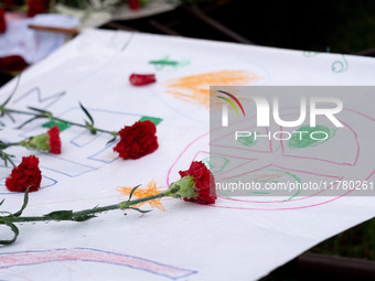 Carnations and wreaths are laid on a monument inside the Athens Polytechnic during the celebration of the 51st anniversary of the Polytechni...