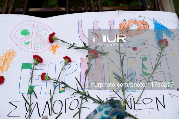 Carnations and wreaths are laid on a monument inside the Athens Polytechnic during the celebration of the 51st anniversary of the Polytechni...