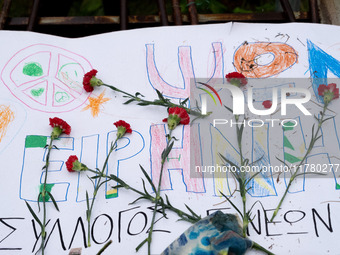 Carnations and wreaths are laid on a monument inside the Athens Polytechnic during the celebration of the 51st anniversary of the Polytechni...