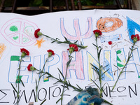 Carnations and wreaths are laid on a monument inside the Athens Polytechnic during the celebration of the 51st anniversary of the Polytechni...