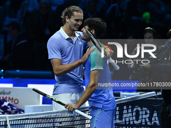 Alexander Zverev (GER) and Carlos Alcaraz (ESP) participate during day six of the Nitto ATP finals 2024 at Inalpi Arena in Turin, Italy, on...