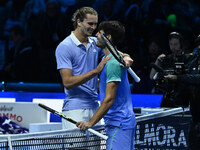 Alexander Zverev (GER) and Carlos Alcaraz (ESP) participate during day six of the Nitto ATP finals 2024 at Inalpi Arena in Turin, Italy, on...