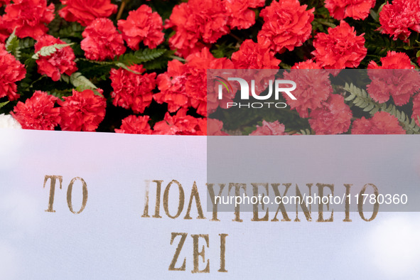 Carnations and wreaths are laid on a monument inside the Athens Polytechnic during the celebration of the 51st anniversary of the Polytechni...