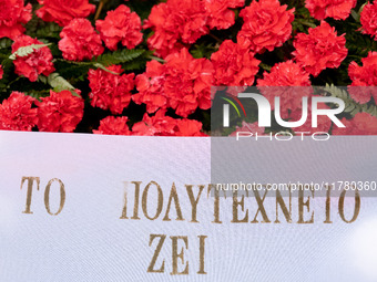 Carnations and wreaths are laid on a monument inside the Athens Polytechnic during the celebration of the 51st anniversary of the Polytechni...