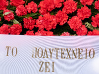 Carnations and wreaths are laid on a monument inside the Athens Polytechnic during the celebration of the 51st anniversary of the Polytechni...