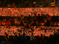 Hindu devotees light clay lamps in front of a temple on the occasion of Kartik Purnima celebrations in Hyderabad, India, on November 15, 202...