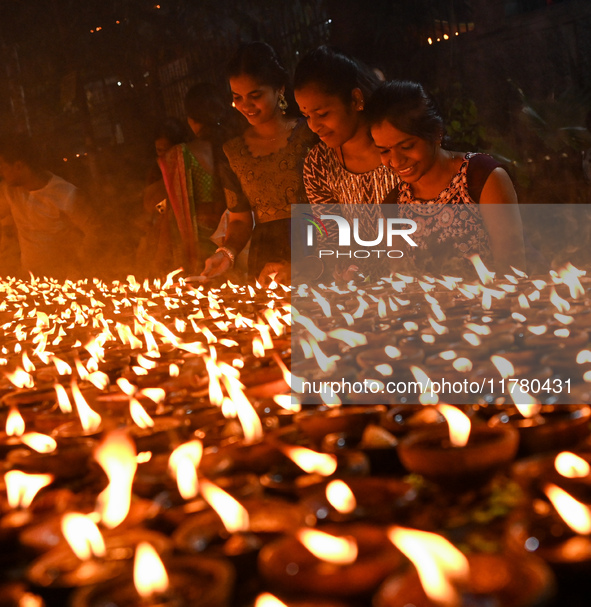 Hindu devotees light clay lamps in front of a temple on the occasion of Kartik Purnima celebrations in Hyderabad, India, on November 15, 202...