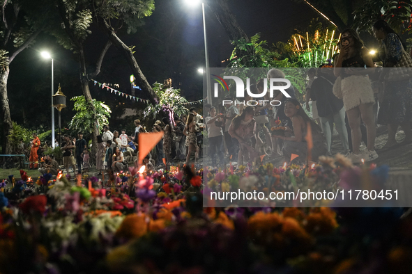 People float Krathong offerings at a park lake during the Thai annual Loy Krathong festival in Bangkok, Thailand, on November 15, 2024. The...