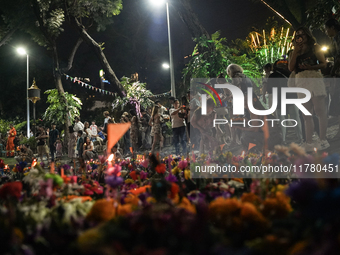 People float Krathong offerings at a park lake during the Thai annual Loy Krathong festival in Bangkok, Thailand, on November 15, 2024. The...