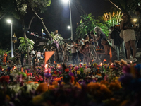 People float Krathong offerings at a park lake during the Thai annual Loy Krathong festival in Bangkok, Thailand, on November 15, 2024. The...