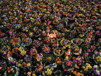 Floating Krathongs, baskets made with leaves and flowers, float in a park lagoon during the Thai annual Loy Krathong festival in Bangkok, Th...