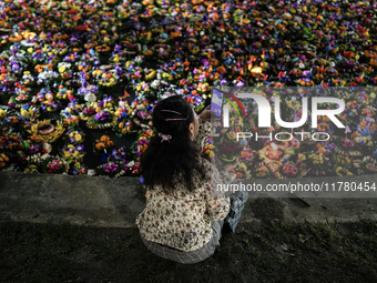 People float Krathong offerings at a park lake during the Thai annual Loy Krathong festival in Bangkok, Thailand, on November 15, 2024. The...