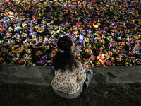 People float Krathong offerings at a park lake during the Thai annual Loy Krathong festival in Bangkok, Thailand, on November 15, 2024. The...