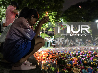 People float Krathong offerings at a park lake during the Thai annual Loy Krathong festival in Bangkok, Thailand, on November 15, 2024. The...