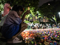 People float Krathong offerings at a park lake during the Thai annual Loy Krathong festival in Bangkok, Thailand, on November 15, 2024. The...