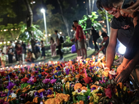 People float Krathong offerings at a park lake during the Thai annual Loy Krathong festival in Bangkok, Thailand, on November 15, 2024. The...