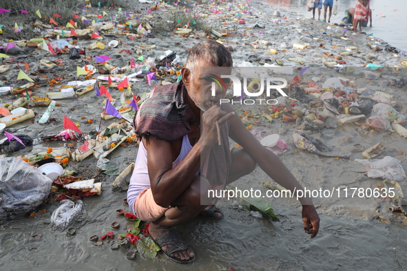 A man brushes his teeth in front of the polluted banks of the river Ganges in Kolkata, India, on November 15, 2024. The Union Environment Mi...