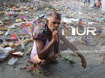 A man brushes his teeth in front of the polluted banks of the river Ganges in Kolkata, India, on November 15, 2024. The Union Environment Mi...