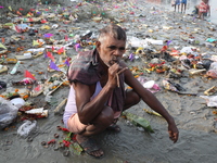 A man brushes his teeth in front of the polluted banks of the river Ganges in Kolkata, India, on November 15, 2024. The Union Environment Mi...