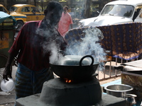 A man prepares food using coal ovens on the banks of the river Ganges in Kolkata, India, on November 15, 2024. The Union Environment Ministr...