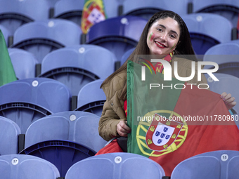 A Portugal fan waits for the start of the UEFA Nations League 2024/25 League A Group A1 match between Portugal and Poland at Estadio Do Drag...